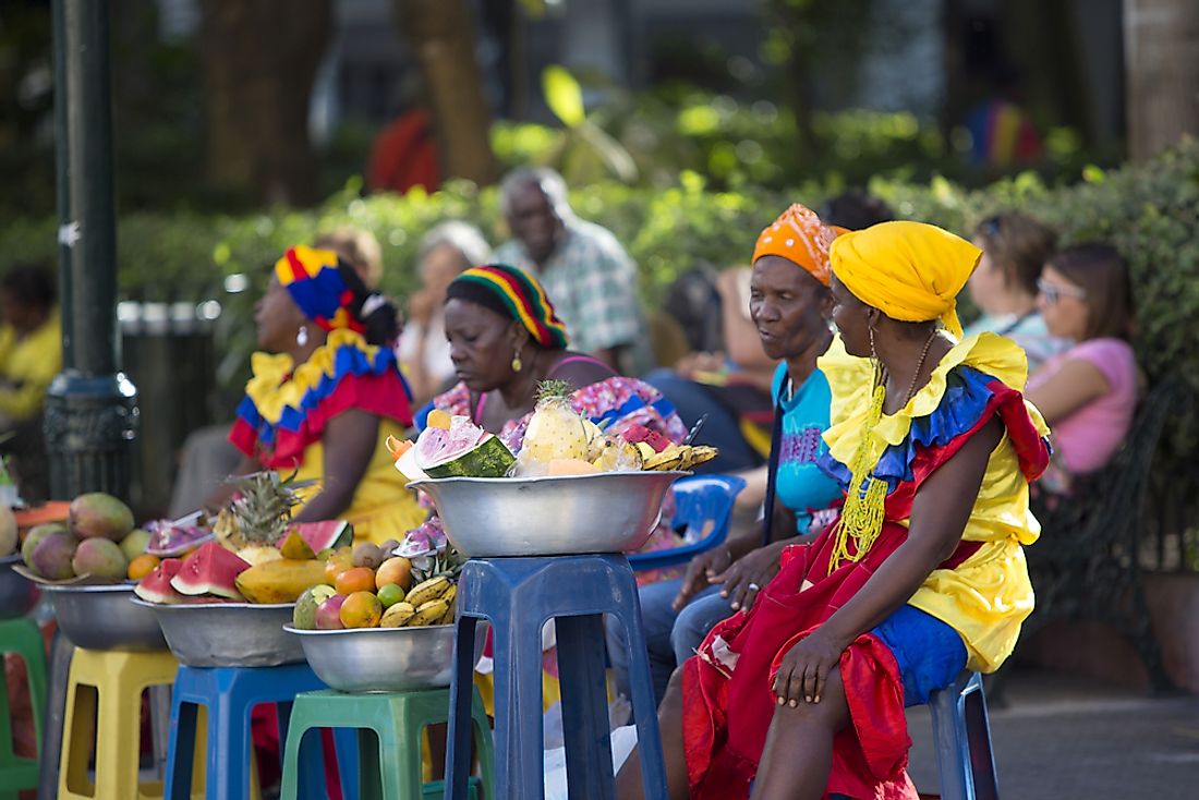 Colombian women sell fruit in the city of Cartagena, Colombia.  Editorial credit: Michel Piccaya / Shutterstock.com.