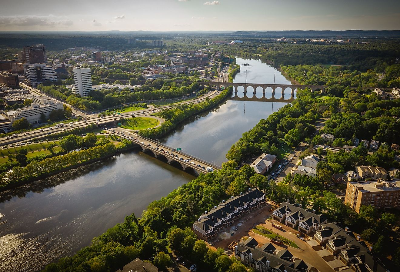 Aerial view of New Brunswick, New Jersey at sunset with the river running through the city.