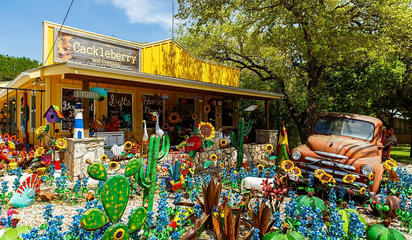 Colorful shop with artwork on display in the small Texas Hill Country town of Wimberley, Texas. Image credit Fotoluminate LLC via Shutterstock