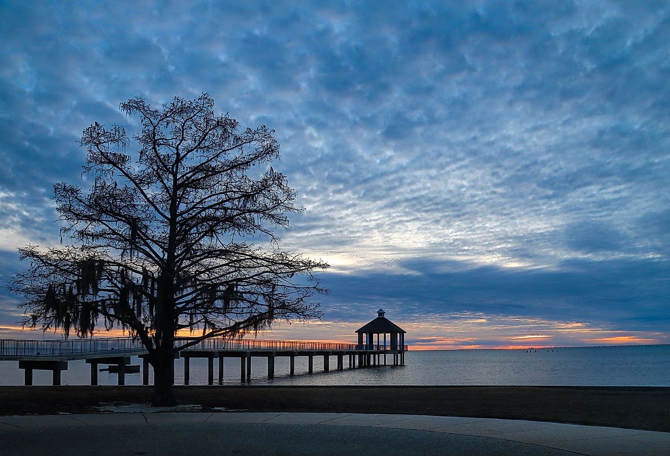 Sunset over Lake Pontchartrain seen from Fontainebleau State Park in Mandeville. Image credit Wirestock Creators via Shutterstock.