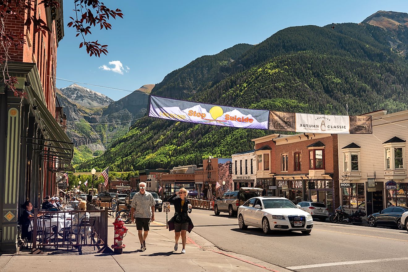 People and traffic move along the downtown Main Street of the historic old mining town in Telluride, Colorado, via Pgiam / iStock.com