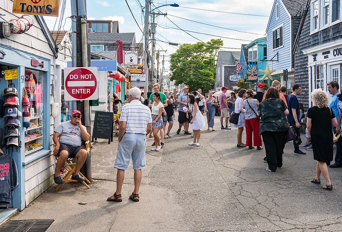 People and tourists stroll through the streets and numerous shops in Rockport. Image credit starmoro via Shutterstock.