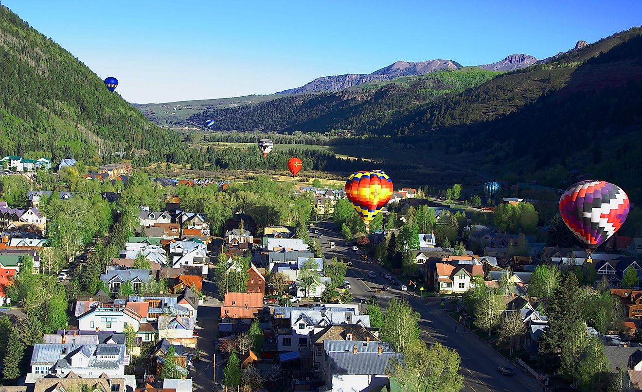 Balloon festival in Telluride Hot Air balloons flying over Town in the morning,Telluride, Colorado