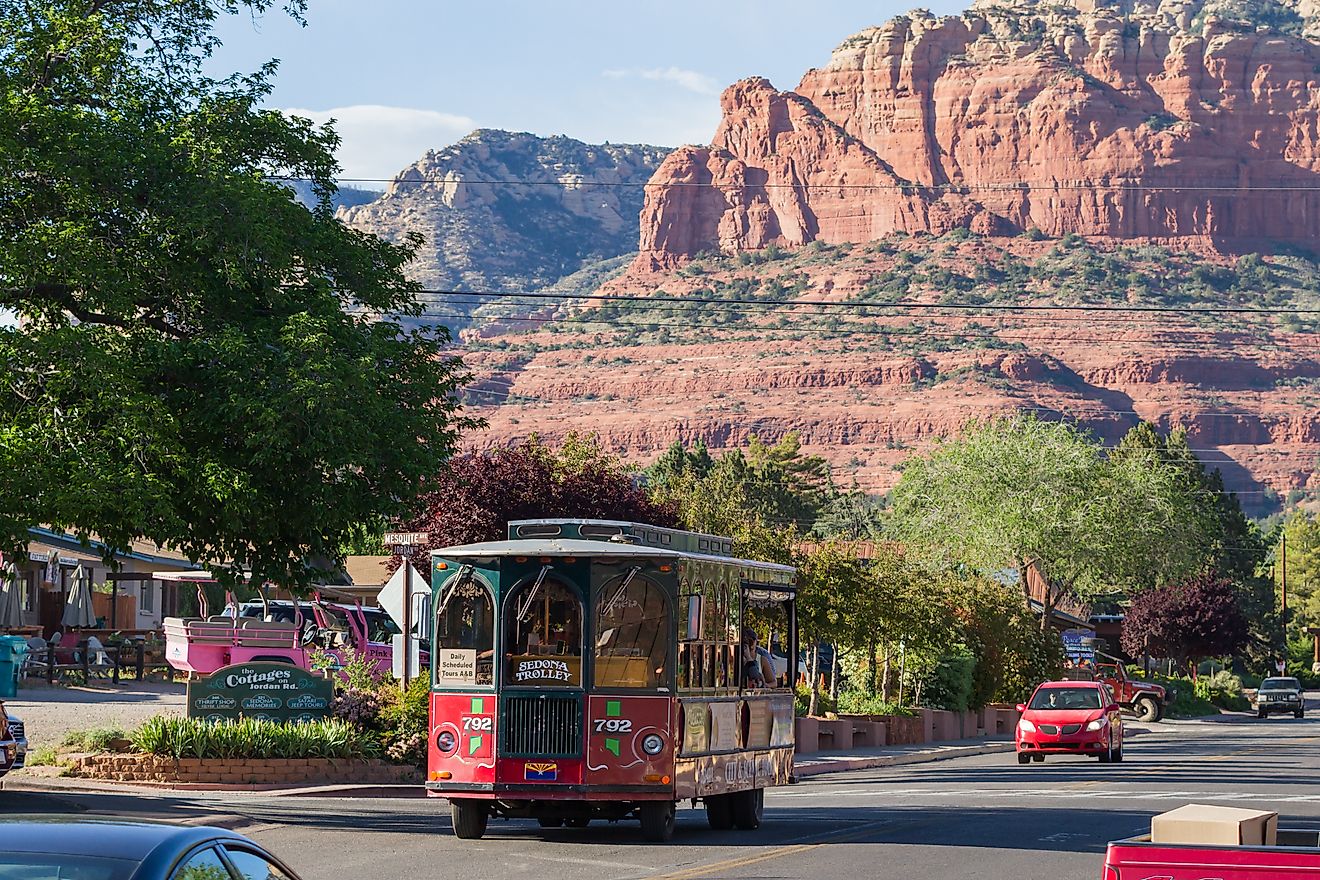 A trolley in Sedona, Arizona, gives a tour of the town under awesome sandstone formations. Image: Wollertz via Shutterstock. 