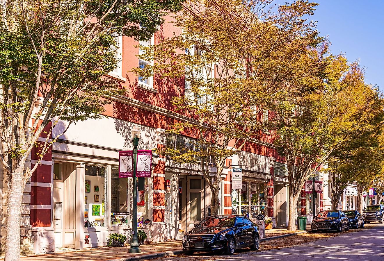 Shady trees lining the sidewalk in New Bern's Historic District. Image credit Wileydoc via Shutterstock.