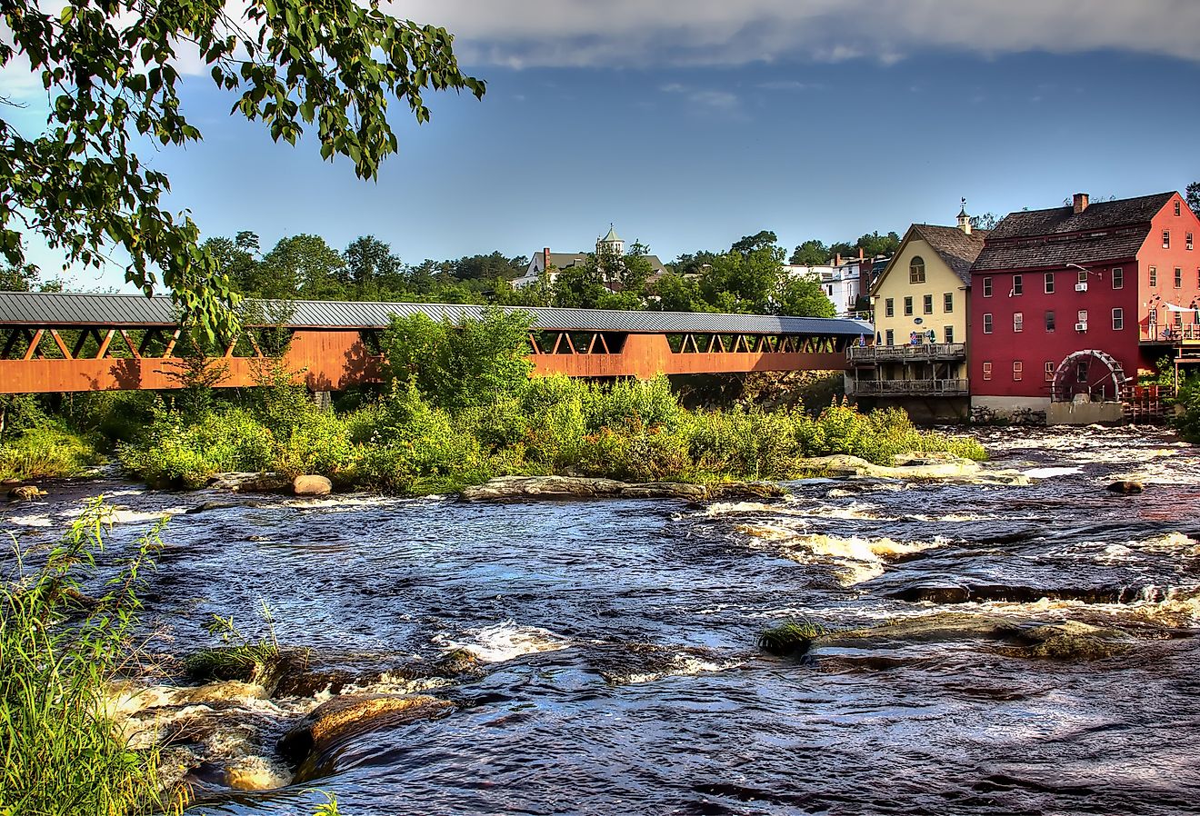 The River Walk overed bridge with the Grist Mill on the Ammonoosuc River in Littleton, New Hampshire.