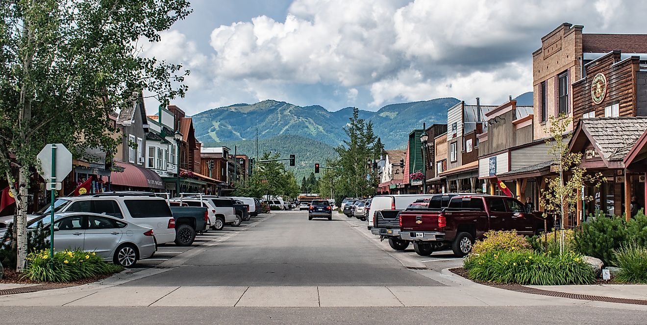 View of Main Street in Whitefish, Montana with tall mountains in the background. Editorial credit: Beeldtype / Shutterstock.com