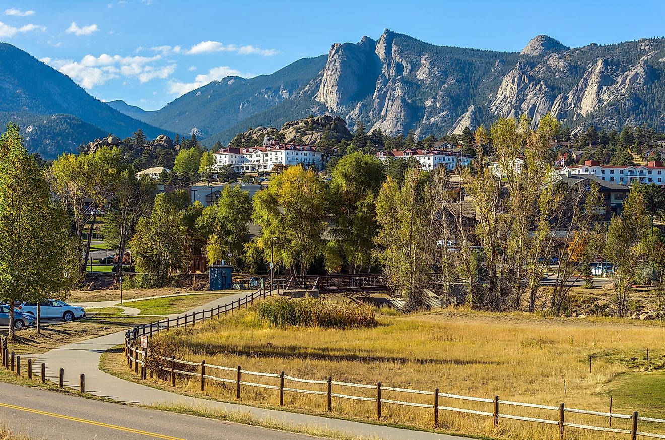 Downtown Estes Park, with The Stanley Hotel and Rocky Mountains in the background.