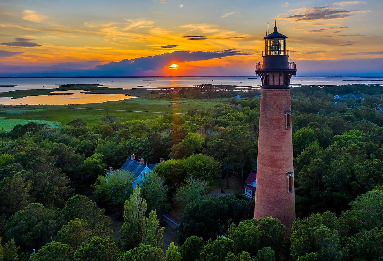 Aerial view of Currituck Beach Lighthouse at sunset near Corolla, North Carolina.