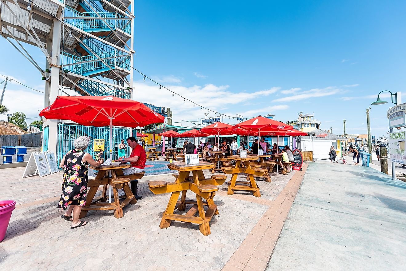 Destin, Florida: City town Harborwalk village Harbor Boardwalk during sunny day in Florida, via Kristi Blokhin / Shutterstock.com