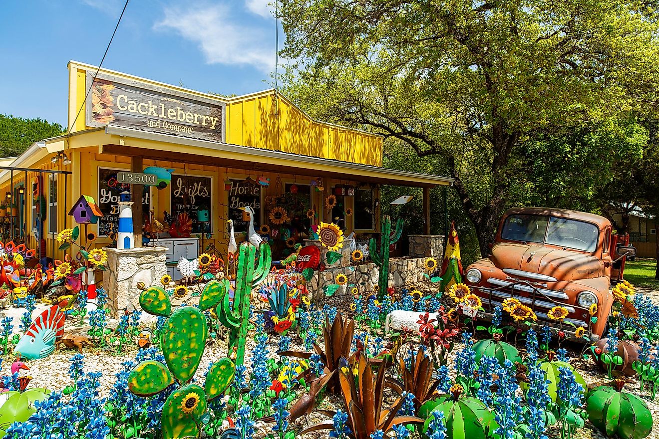 Colorful shop with artwork on display in the small Texas Hill Country town of Wimberley, via Fotoluminate LLC / Shutterstock.com