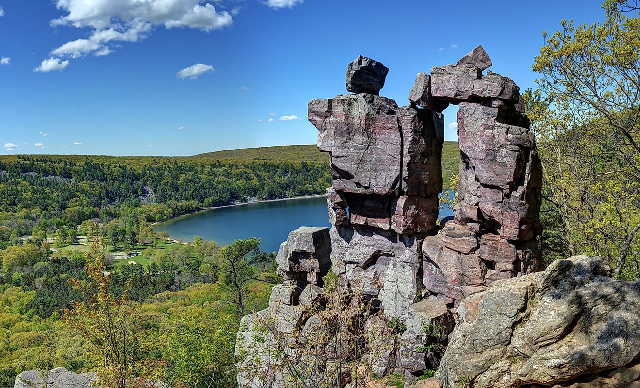 The iconic Devil's Doorway with Devil's Lake in the background in Devil's Lake State Park.