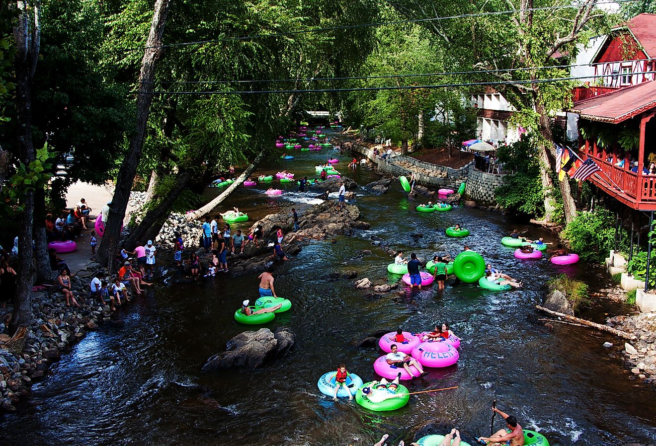 Tourist tubing the lazy river Chattahoochee in Alpine Helen, Georgia. Image credit Paul Hakimata Photography via Shutterstock