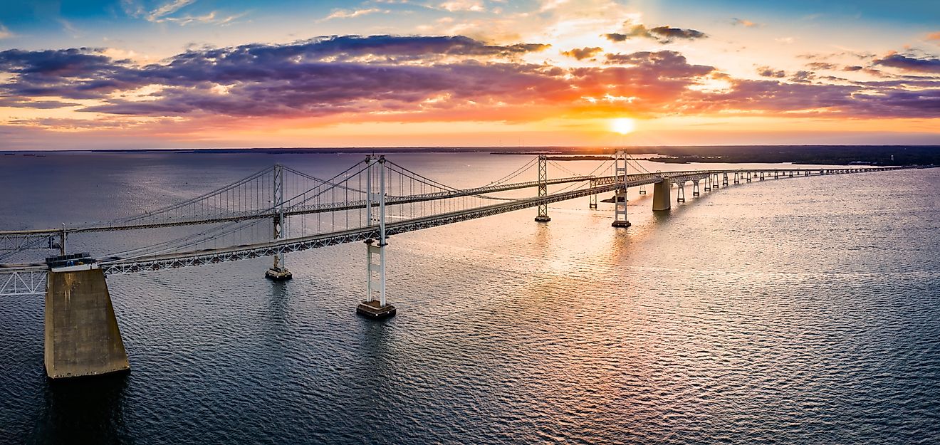 Aerial panorama of the Chesapeake Bay Bridge at sunset in Maryland.