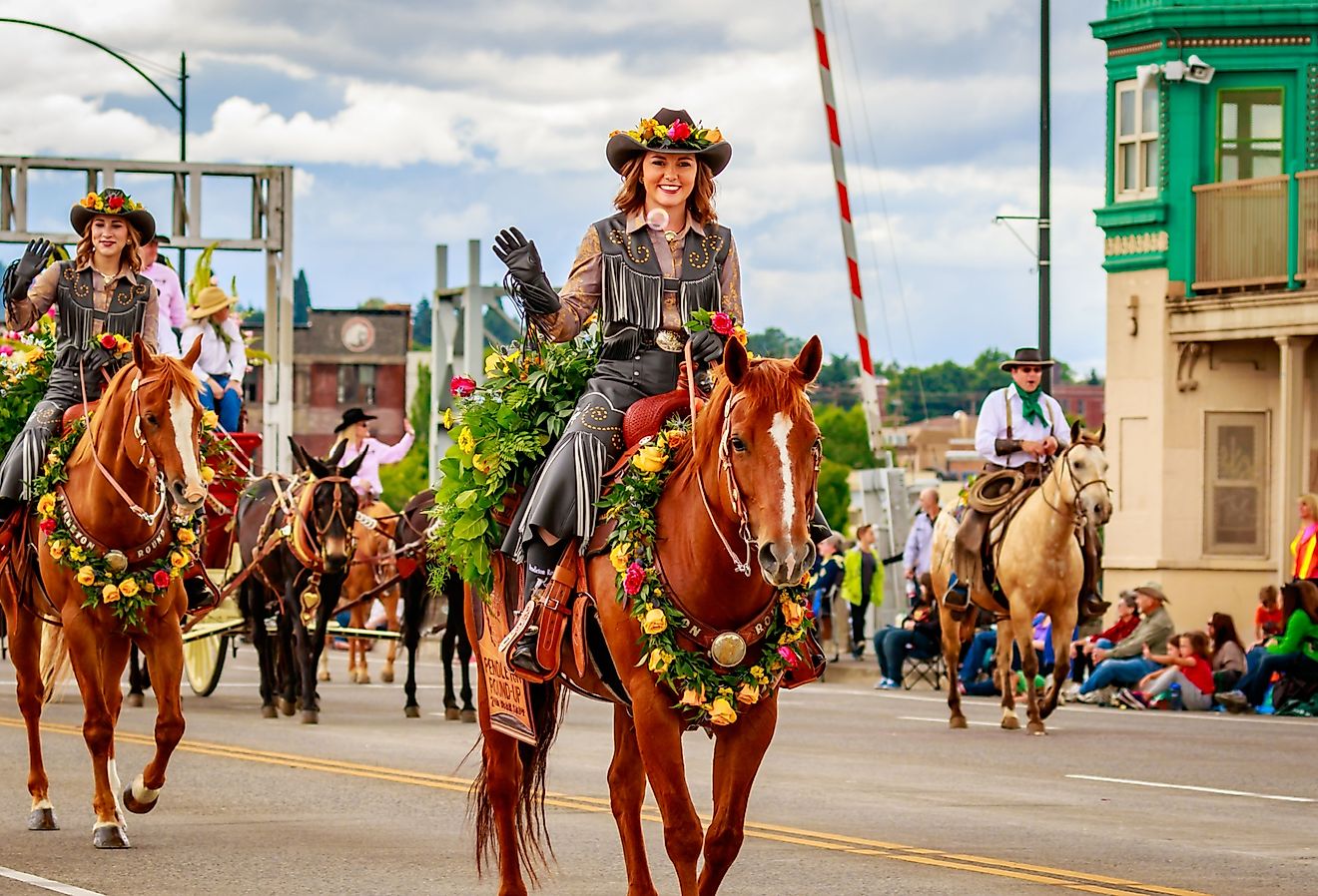 Horse riders during the lively Pendleton Round-Up in Pendleton, Oregon. Image credit: Png Studio Photography via Shutterstock.
