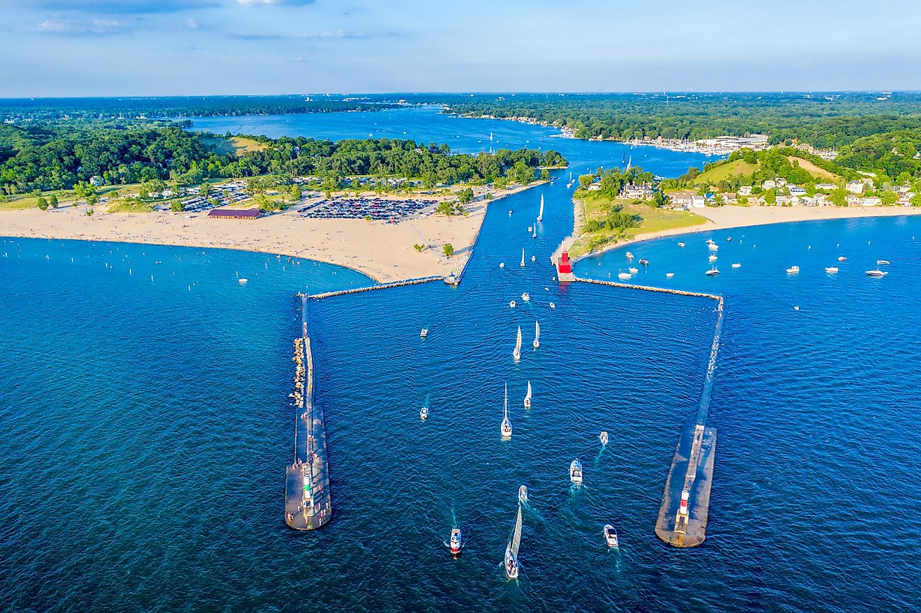 Aerial view of the Holland Harbor Lighthouse, known as the Big Red Lighthouse, at the channel connecting Lake Macatawa with Lake Michigan.