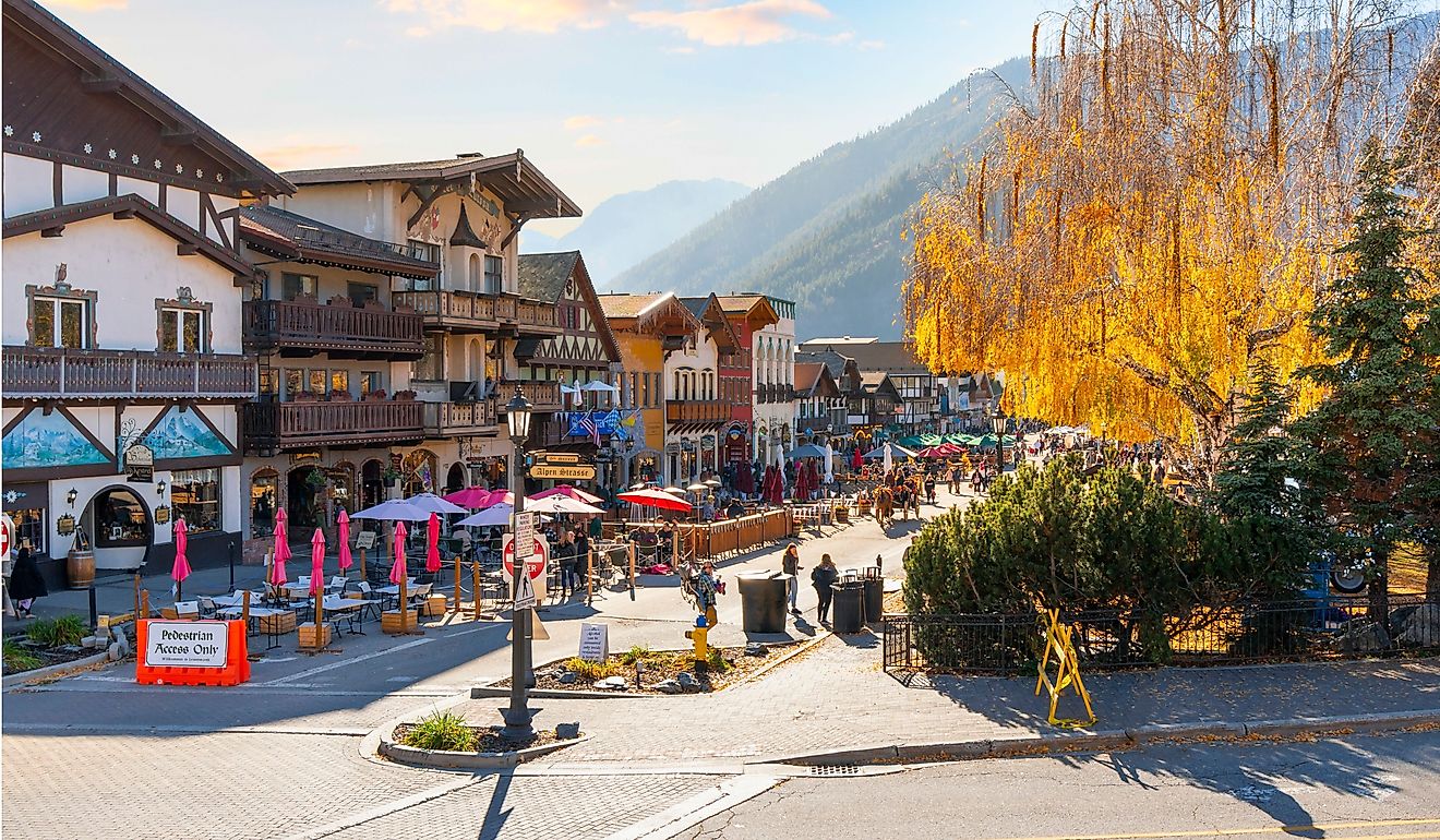 Autumn afternoon at the Bavarian themed village of Leavenworth, Washington, with themed sidewalk cafes and shops on the pedestrian main street. Editorial credit: Kirk Fisher / Shutterstock.com
