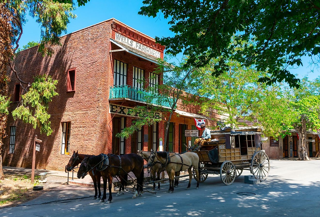 Stagecoach near a historic building, Columbia State Historic Park, Columbia, CA, USA. Editorial credit: Michael Vi / Shutterstock.com