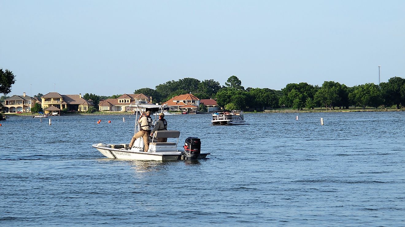 Texas Game Wardens in boat patrolling Lake Granbury on the 4th of July, via Christine_Kohler / iStock.com