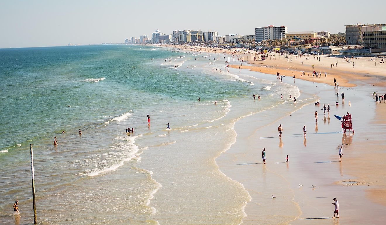 Daytona Beach with people swimming.