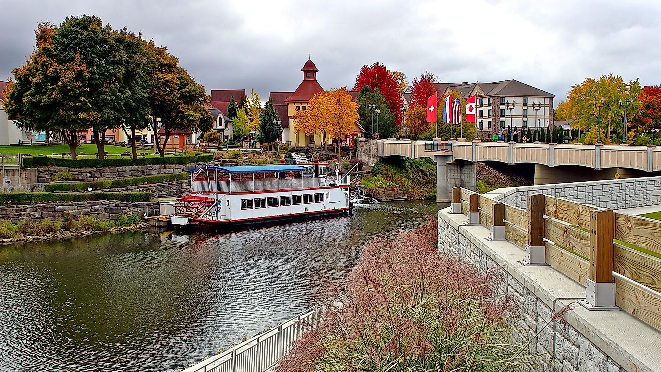 Frankenmuth, Michigan in the fall, with the iconic boat near the Bavarian Lodge and vibrant autumn colors in the background