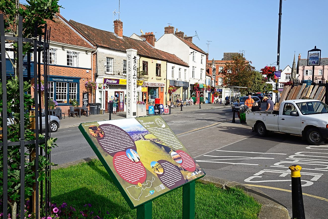 The Glastonbury Way information sign along Magdalene Street with town shops to the rear, Glastonbury, UK, via Caron Badkin / Shutterstock.com