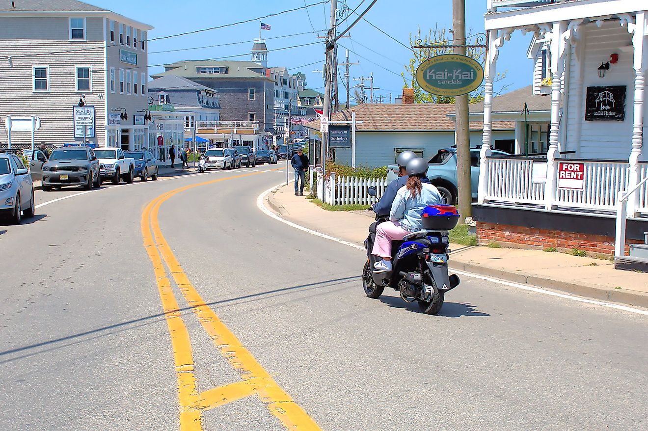 Moped driver and passenger navigating the roads of New Shoreham. Editorial credit: Ray Geiger / Shutterstock.com