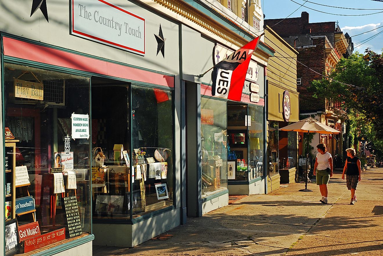 Two adult women window shop along the Main Street in Cold Spring, New York, via Kirkikis / iStock.com