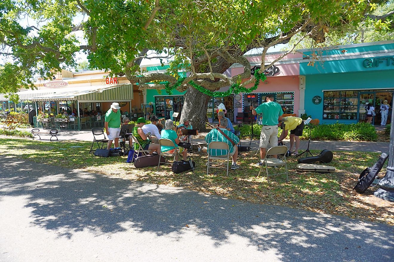 Dunedin, Florida. People enjoying Saint Patrick's Day downtown, via caleb kurtz / Shutterstock.com