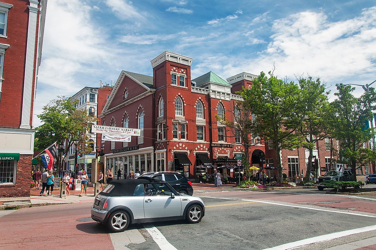 The historic downtown area of Salem, Massachusetts, on a sunny day, featuring well-preserved buildings, bustling streets, and a mix of shops and local landmarks. Editorial credit: Dan Hanscom / Shutterstock.com