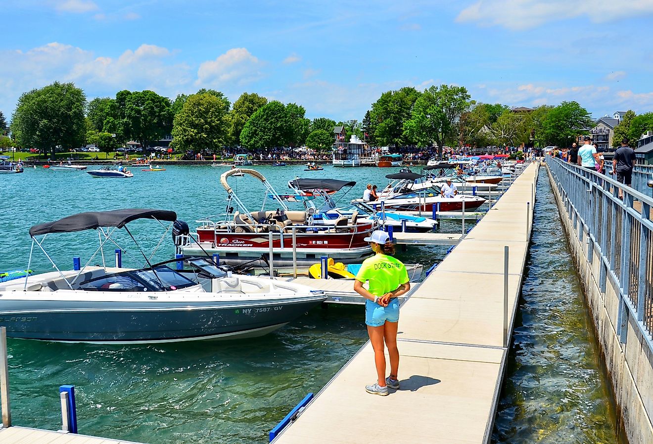 Pier and luxury boats docked at Skaneateles Lake, New York. Image credit PQK via Shutterstock