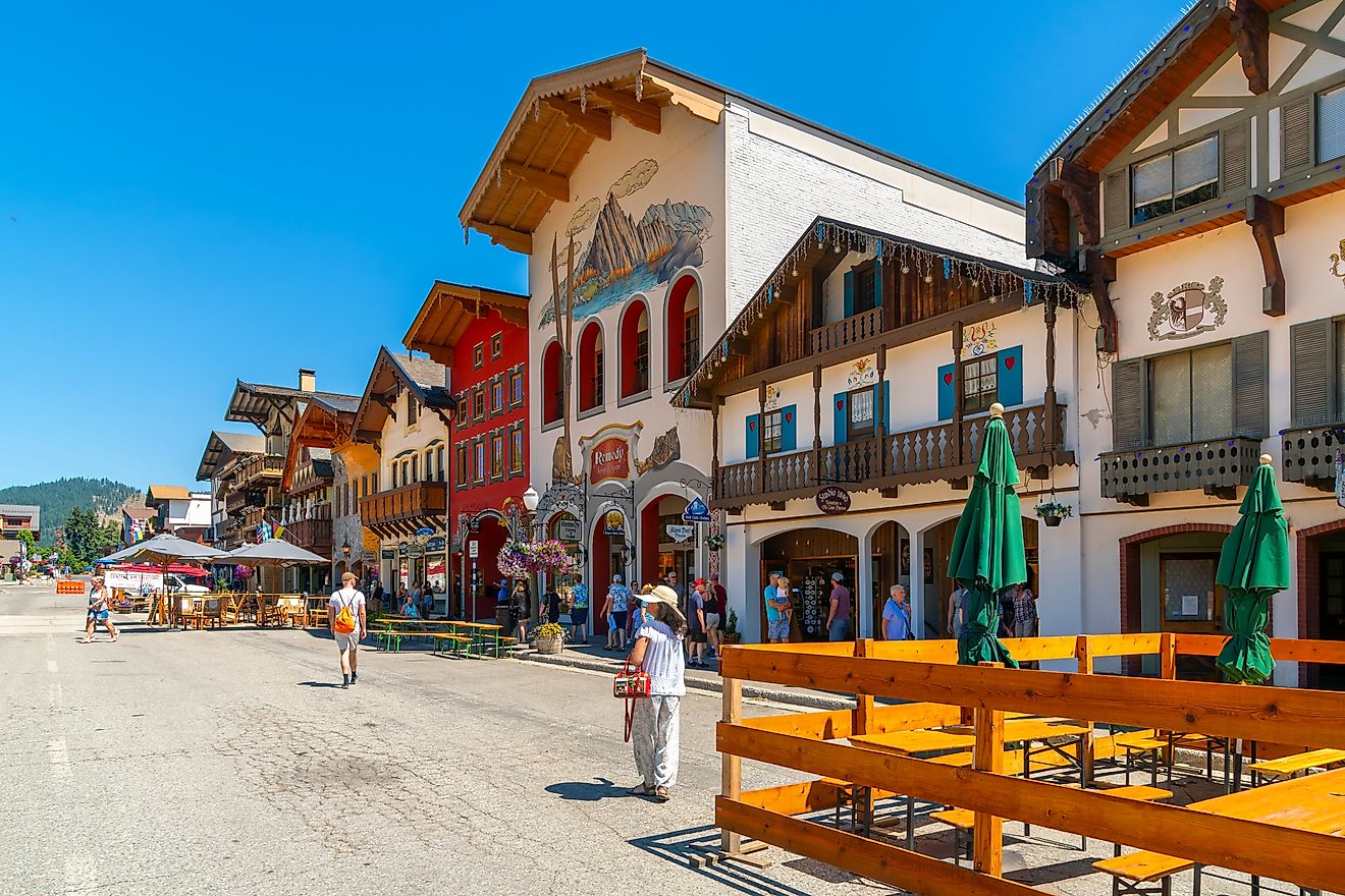 Quaint Bavarian-themed main street of Leavenworth, Washington, lined with shops and sidewalk cafes in the mountains of Central Washington State. Editorial credit: Kirk Fisher / Shutterstock.com