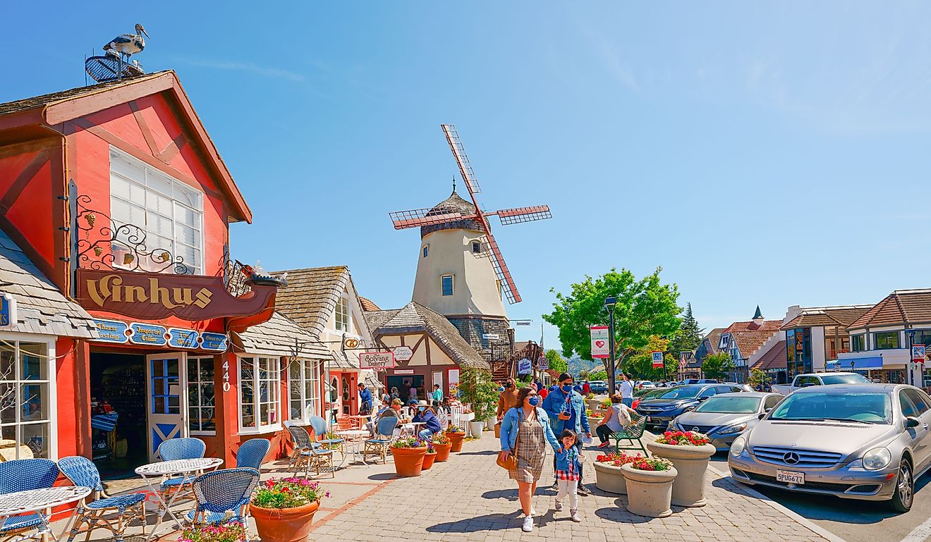 Main street, street view, and tourists in Solvang, beautiful small town in California, town has known for its traditional Danish style architecture. Editorial credit: HannaTor / Shutterstock.com