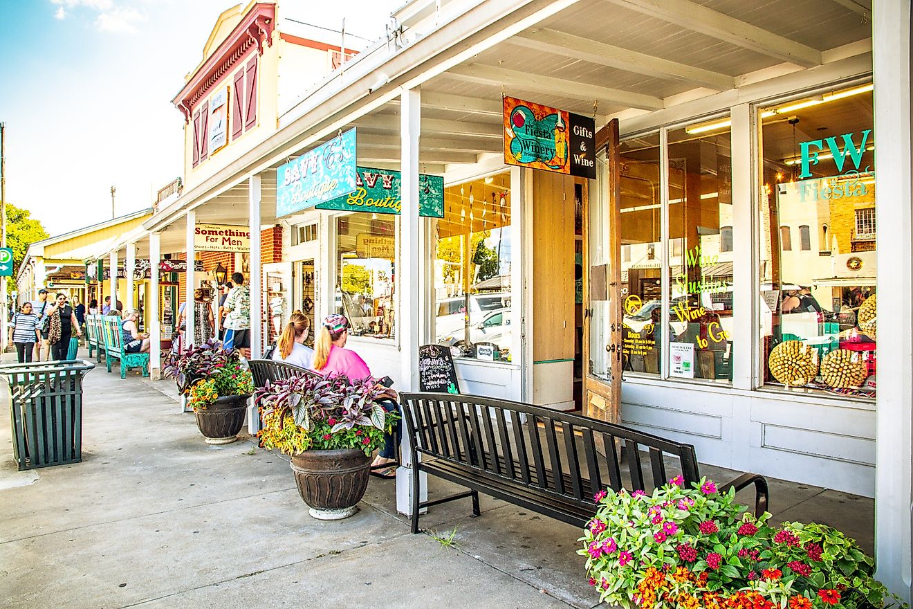 The Main Street in Frederiksburg, Texas, also known as "The Magic Mile", with retail stores and poeple, via ShengYing Lin / Shutterstock.com