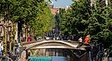 Summer cityscape with architecture traditional canal houses, 3D-printed steel bridge, Red light district, Stoofsteeg, Oudezijds Achterburgwal, Holland, via Wut_Moppie / Shutterstock.com