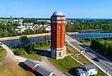 The Old Manistique Water Tower with the town in the background. Image credit Dennis MacDonald via Shutterstock