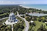 Aerial view of a temple, harbor, and shoreline in Wilmette, Illinois, showcasing the picturesque landscape along Lake Michigan.