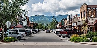 View of buildings and mountains from downtown Whitefish in Montana. Editorial credit: Beeldtype / Shutterstock.com