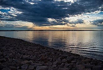 The scenic Hillsdale Lake and its rocky coast at sunset in Kansas.