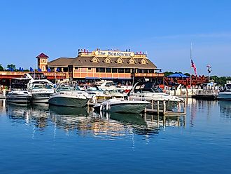 Put-in-bay, Ohio - May 27, 2018: Boats tied up at A-Dock with the famous Boardwalk restaurant in the background.