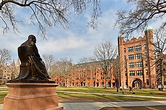 Theodore Dwight Woolsey statue and Phelps Hall on campus of Yale University in New Haven, Connecticut. Image credit: Jay Yuan / Shutterstock.