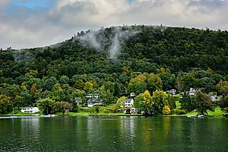 Cooperstown, New York: Homes along the shore of Ostego Lake, the source of the Susquehanna River, via Steve Cukrov / Shutterstock.com