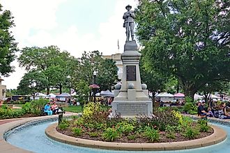 View of the Bentonville Confederate Monument, a granite statue of a Confederate soldier located in downtown. Editorial credit: EQRoy / Shutterstock.com. 