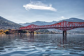 Big Orange Bridge over Kootenay River with Nelson, British Columbia in the background