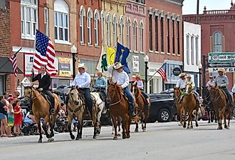 Horses and riders in the Washunga Days Parade in Council Grove, Kansas. Image credit mark reinstein via Shutterstock