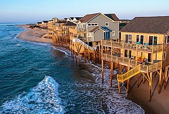 Aerial view of homes on the shoreline during high tide in Buxton, North Carolina, Outer Banks.