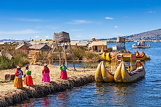 Locals welcome tourists to Uros Island on Lake Titicaca.