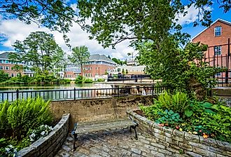 Gardens and bench along the Winnipesaukee River, in Laconia, New Hampshire.