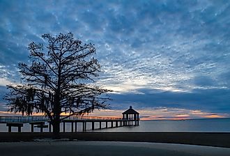 Sunset over Lake Pontchartrain seen from Fontainebleau State Park in Mandeville. Image credit Wirestock Creators via Shutterstock.