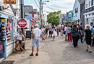 People and tourists stroll through the streets and numerous shops in Rockport. Image credit starmoro via Shutterstock.